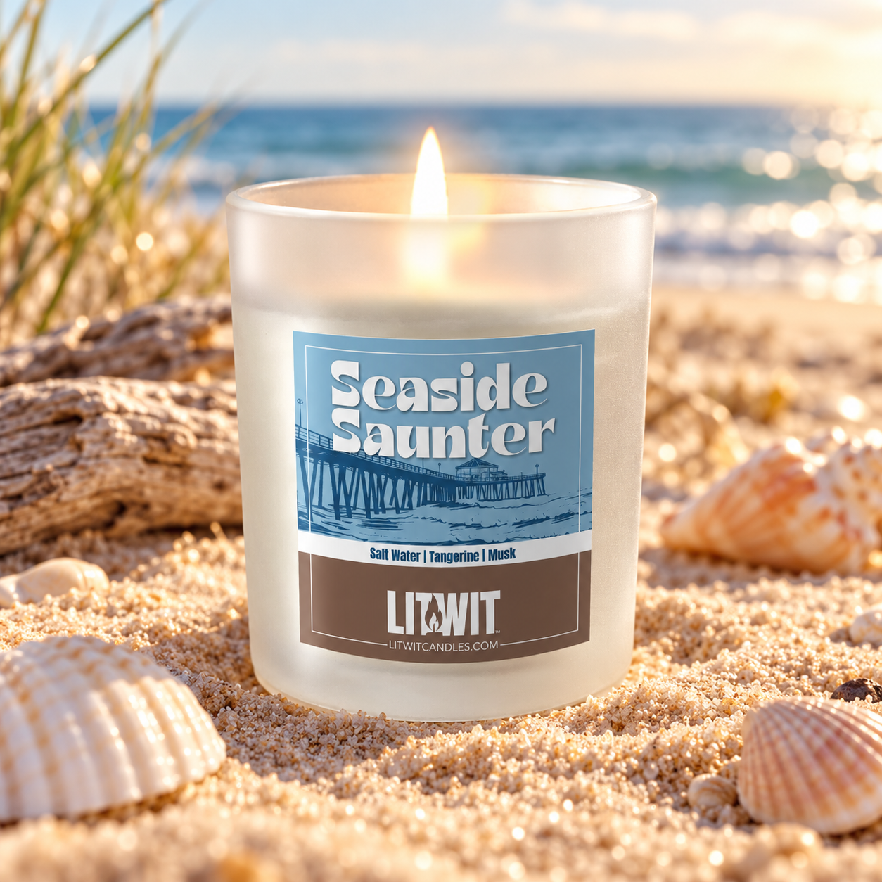 Seaside Saunter soy candle in frosted glass jar on a coastal beach with salt water tangerine and musk fragrance